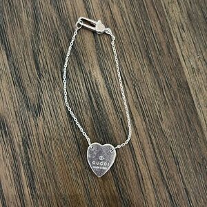 TRADEMARK BRACELET WITH HEART PENDANT